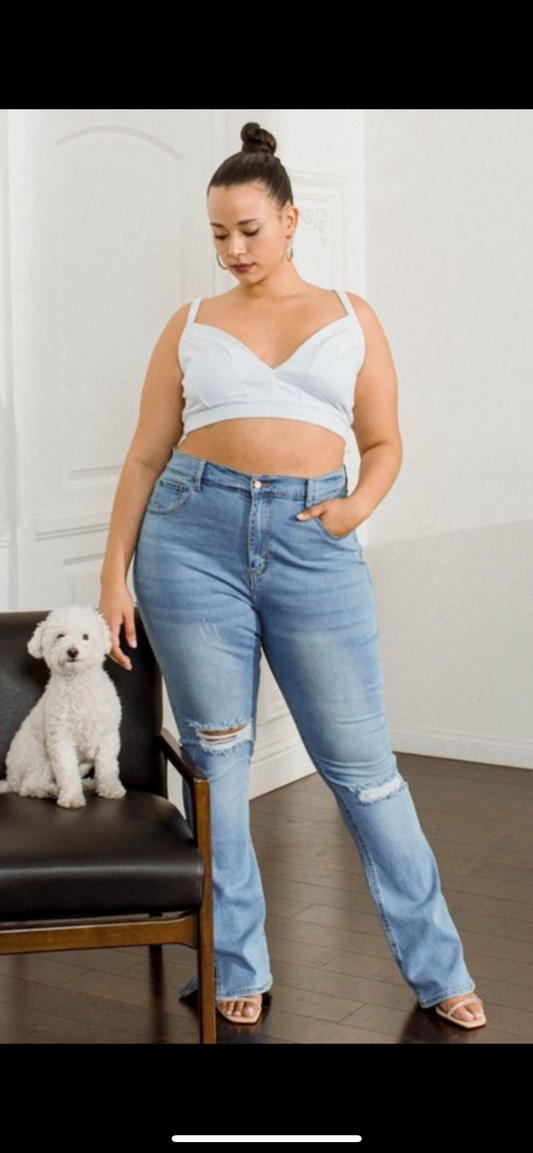 curvy destroyed light blue jeans